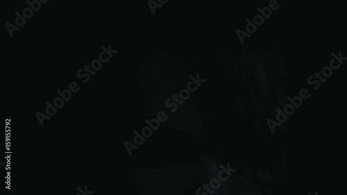 Face of a beautiful girl in the dark close-up