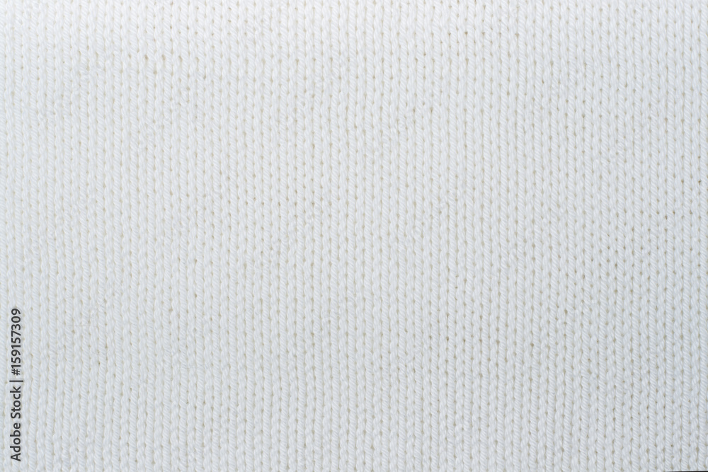 Sweater or scarf fabric texture large knitting. Knitted jersey background with a relief pattern. Wool hand- machine, handmade. Sweater or scarf fabric texture large knitting. Knitted jersey background with a relief pattern. Wool hand- machine, handmade.