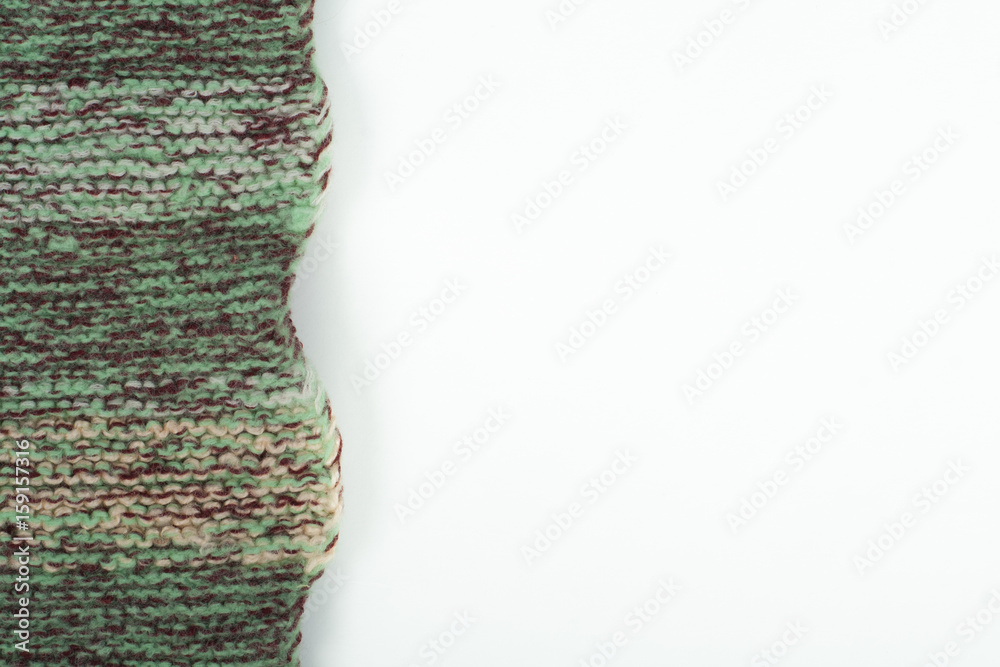 Fototapeta premium Sweater or scarf fabric texture large knitting. Knitted jersey background with a relief pattern. Wool hand- machine, handmade.