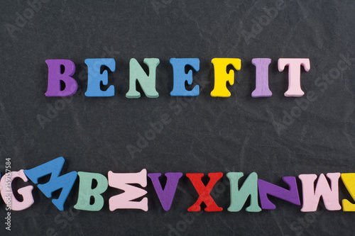 BENEFIT word on black board background composed from colorful abc alphabet block wooden letters, copy space for ad text. Learning english concept.