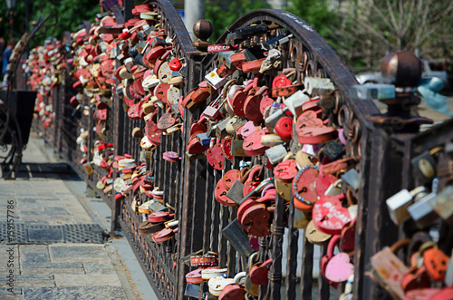 A huge number of locks on the railing of the bridge - a tradition for a wedding.