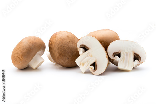 Fresh champignon mushrooms isolated on white.