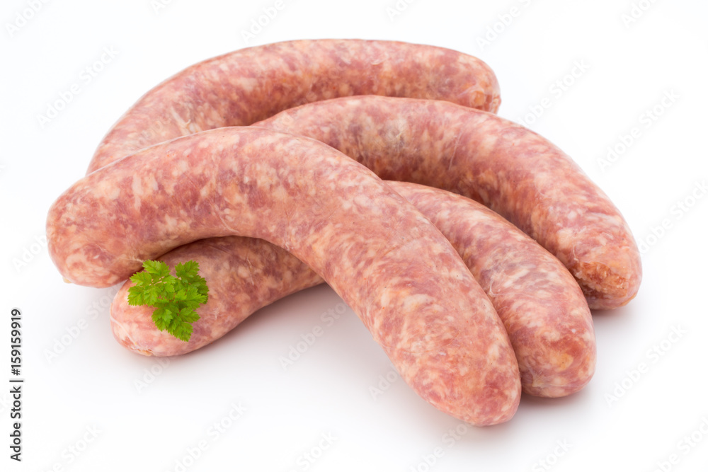 Raw sausage with parsley leaf isolated on white background.