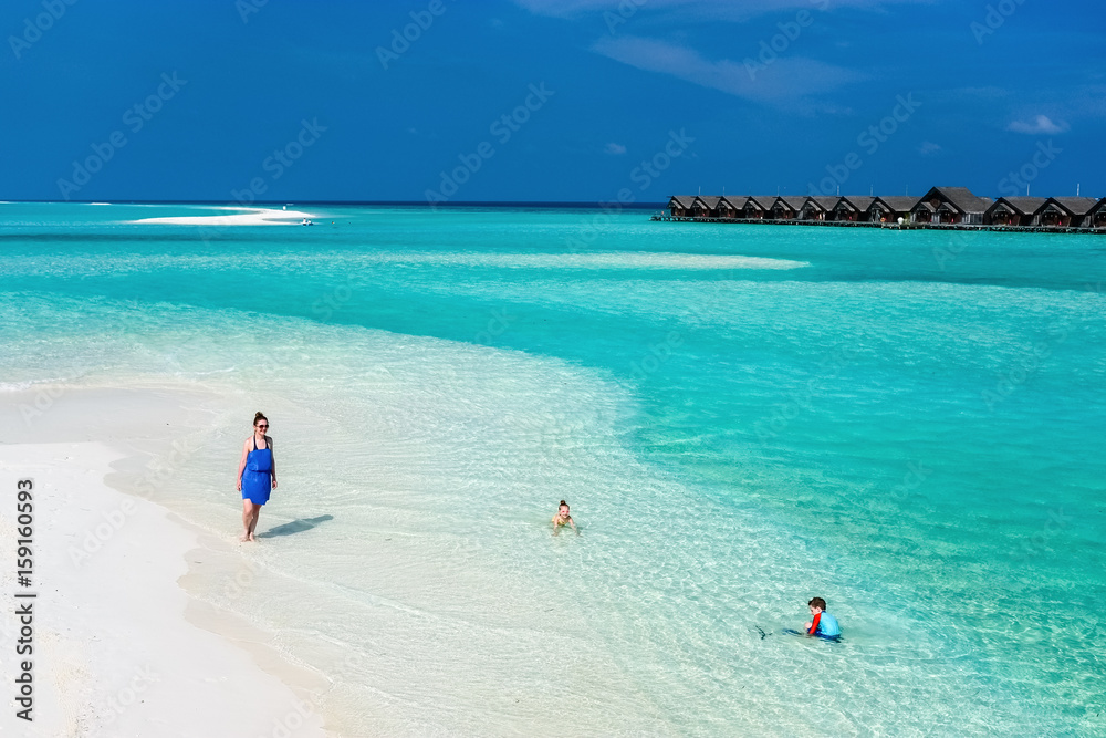 Mother and kids at tropical beach
