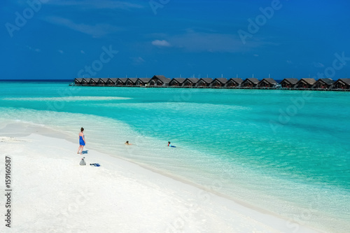 Mother and kids at tropical beach