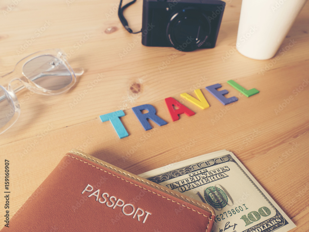 Accessories for travel, on wooden table.