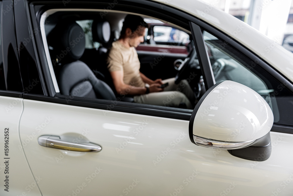 Man locating in new automobile Man locating in new automobile