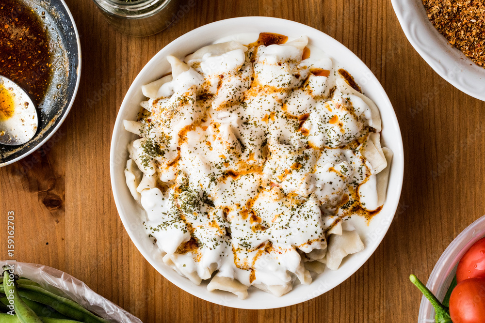 Turkish Manti Manlama / Ravioli with yogurt and fried butter sauce. Turkish Manti Manlama / Ravioli with yogurt and fried butter sauce.