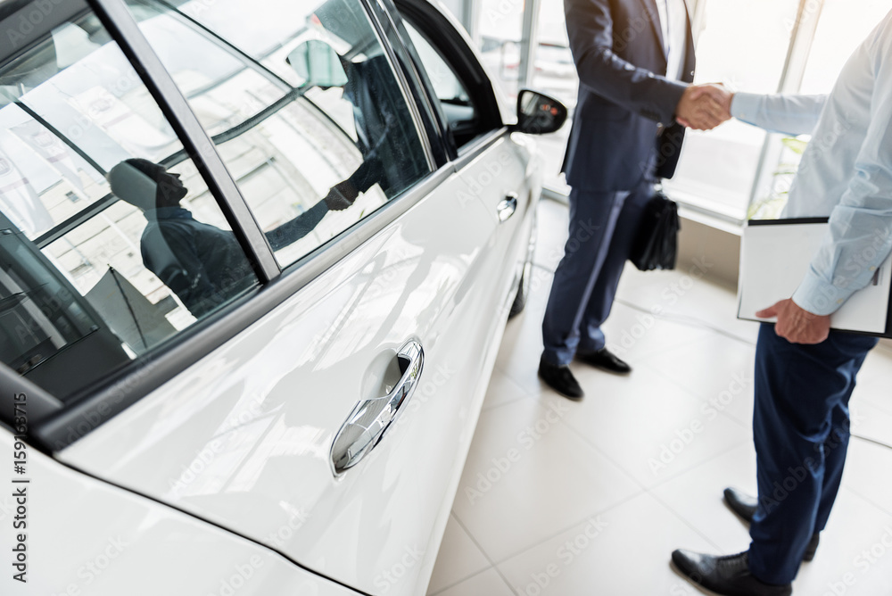 Business deal concerning purchase of new car Business deal concerning purchase of new car