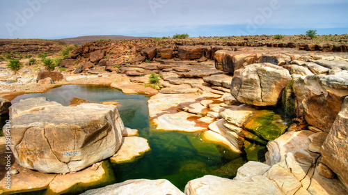 Panorama of rocky pond on Adrar plateau in Mauritania photo