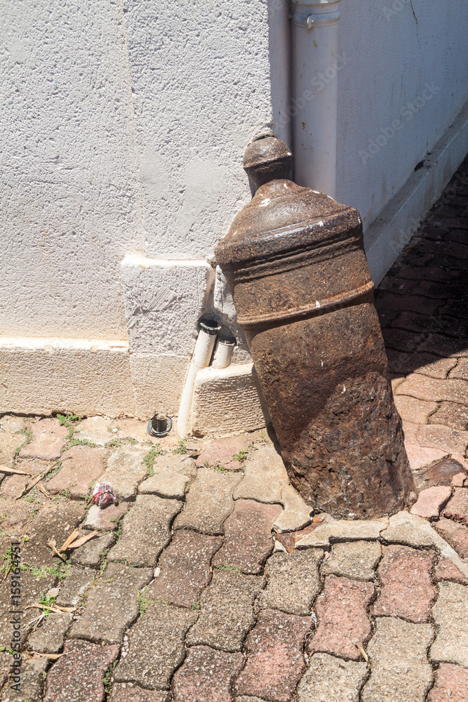 Spur stone of a building made of an old cannon in Cayenne, capital of French Guiana. Spur stone of a building made of an old cannon in Cayenne, capital of French Guiana.