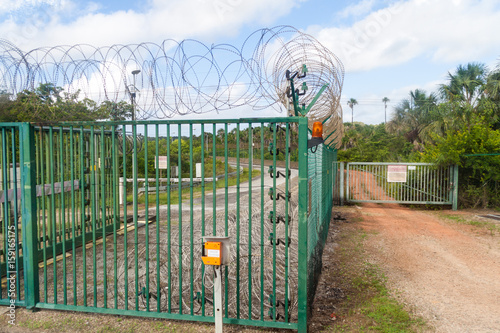 Security fence at Centre Spatial Guyanais (Guiana Space Centre) in Kourou, French Guiana photo