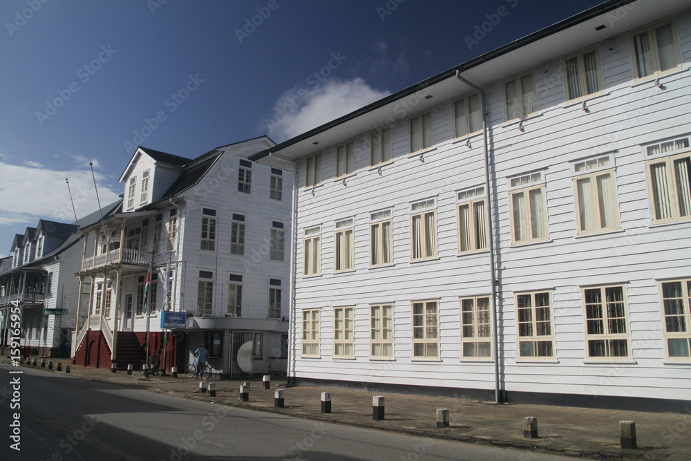 PARAMARIBO, SURINAME - AUGUST 6, 2015: Street with old colonial buildings in Paramaribo, capital of Suriname.