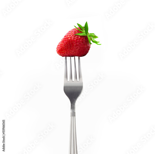 Strawberry on a fork isolated on white background