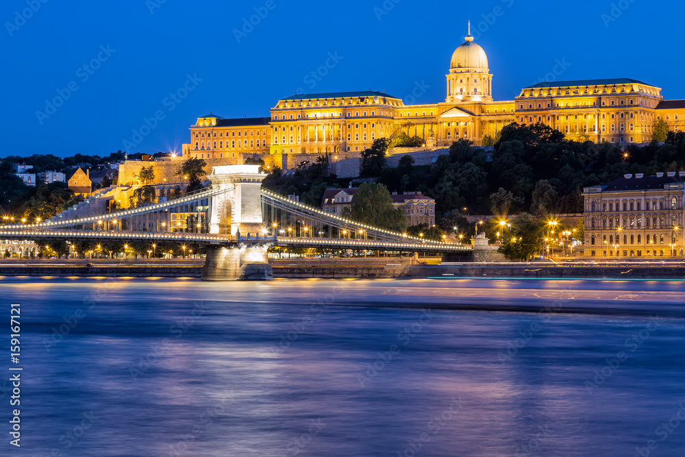 Budapest by night - Night view of the Szechenyi Chain Bridge, that spans the River Danube between Buda and Pest and Buda Castle