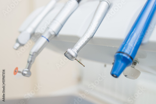Closeup shoot of dental instruments in clinic, turbines, handpieces and drills.