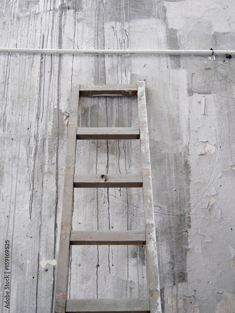 Old wood ladder on a wall Old wood ladder on a wall