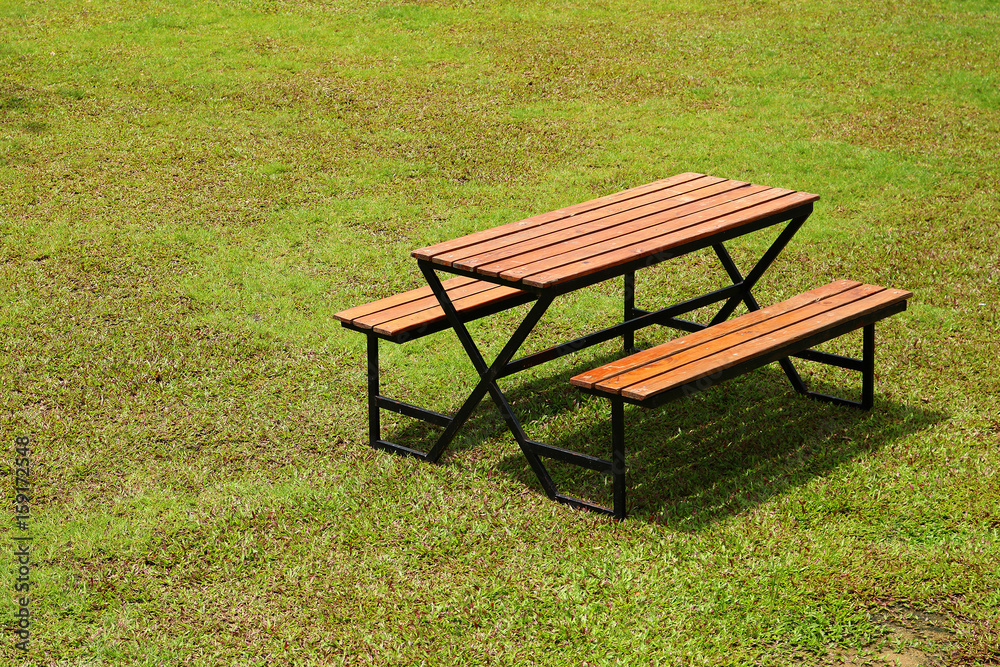 modern wooden bench on greensward modern wooden bench on greensward
