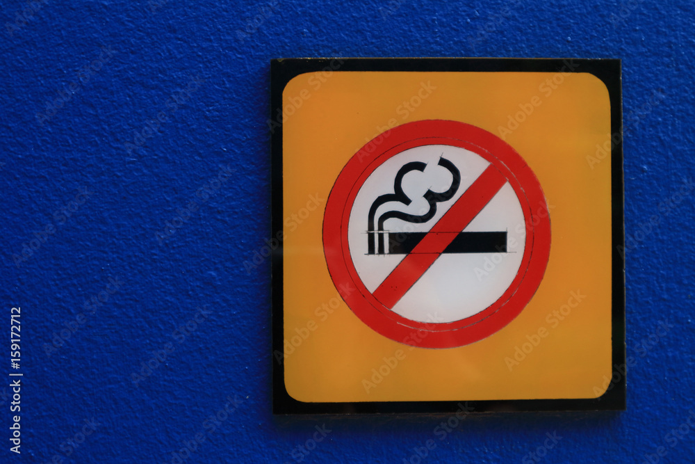 No smoking sign. A sign showing no smoking is allowed. Red round no smoking sign. Smoking prohibited symbol isolated on blue background. No smoking sign. A sign showing no smoking is allowed. Red round no smoking sign. Smoking prohibited symbol isolated on blue background.
