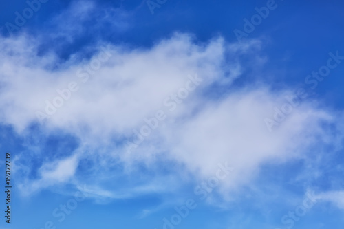 Blue sky with clouds close up image as a background