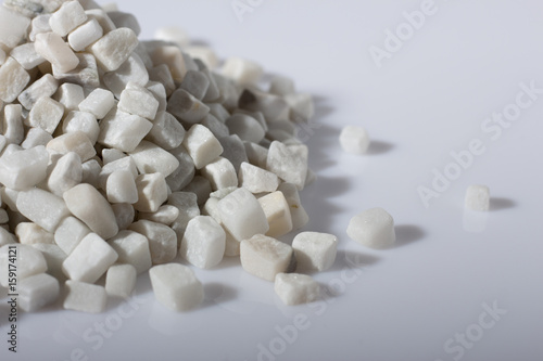 beautiful natural white stone scattered on a white background