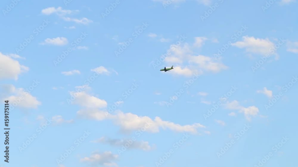 Passenger plane flies in the sky, Blue sky with clouds Passenger plane flies in the sky, Blue sky with clouds