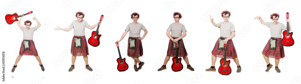 Scotsman playing guitar isolated on white Scotsman playing guitar isolated on white