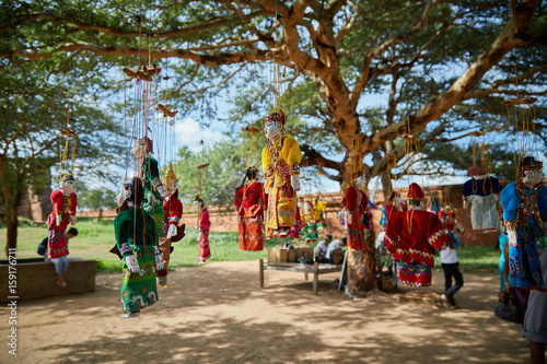 Traditional Burmese puppets hanging on display outside the Dhammayangyi Temple, Bagan Myanmar (Burma)