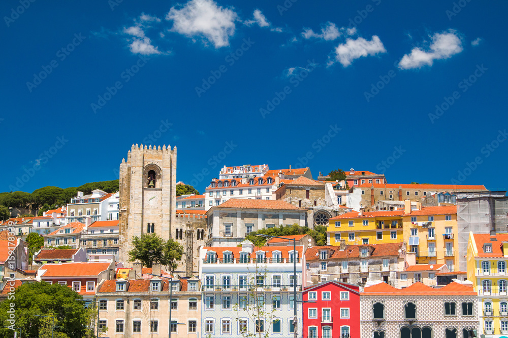     Tower bells of patriarchal Cathedral of St. Mary Major (Santa Maria Maior de Lisboa) and red roofs in Lisbon, Portugal 