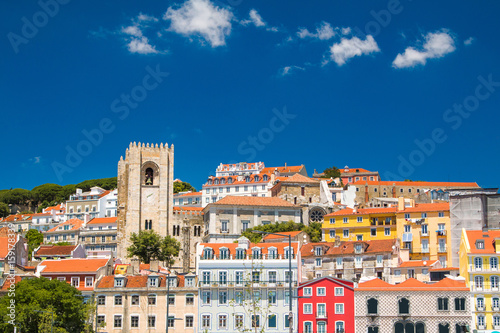  Tower bells of patriarchal Cathedral of St. Mary Major (Santa Maria Maior de Lisboa) and red roofs in Lisbon, Portugal 