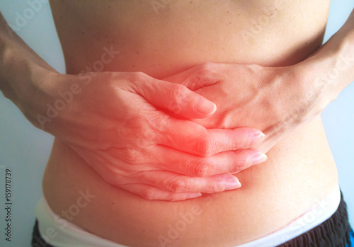 Close-Up woman stomach ache on white background