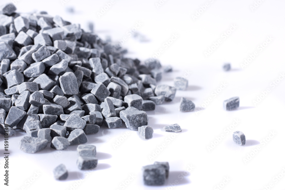 Fototapeta premium beautiful natural gray stones scattered on a white background