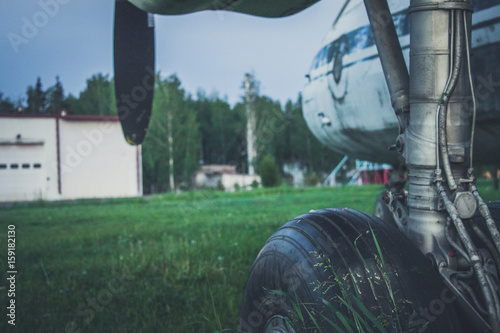 An old, abandoned plane. Chassis. Propeller. Wing