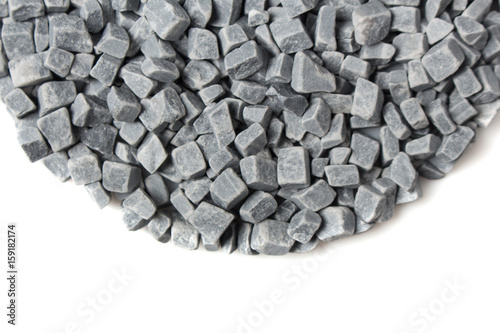 beautiful natural gray stones scattered on a white background