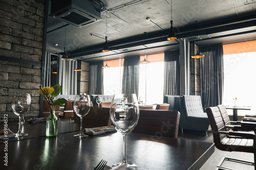 restaurant hall with a glass on the table photo