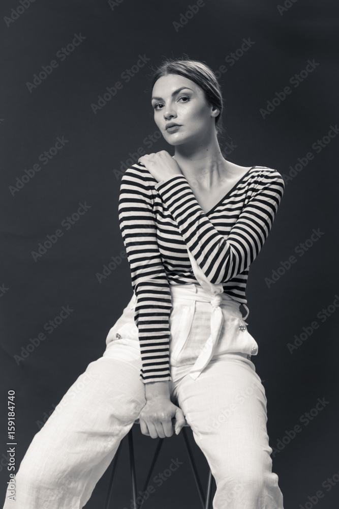 Black man sitting on a stool hi-res stock photography and images - Alamy