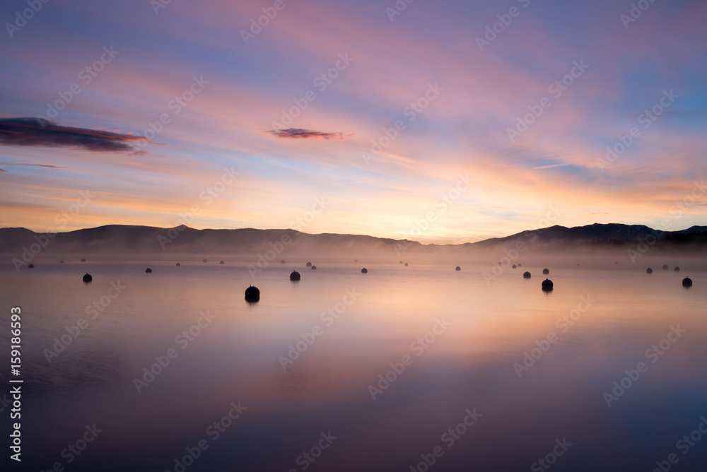 Sunrise over tranquil mountain lake