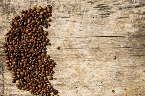 Coffee beans on wooden background