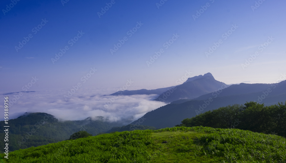 Fototapeta premium Mist and mountains in the natural park of Aiako Harri