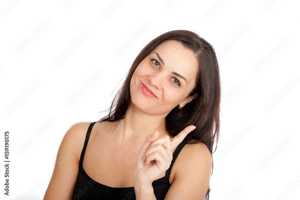 Young attractive woman smiling and pointing her finger Young attractive woman smiling and pointing her finger