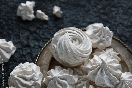 vanilla homemade zephyr and cacao mug on dark stone background. sweet delicious marshmallows   selective focus