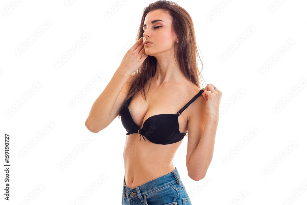 sexy woman with big breasts takes off bra Stock Photo | Adobe Stock