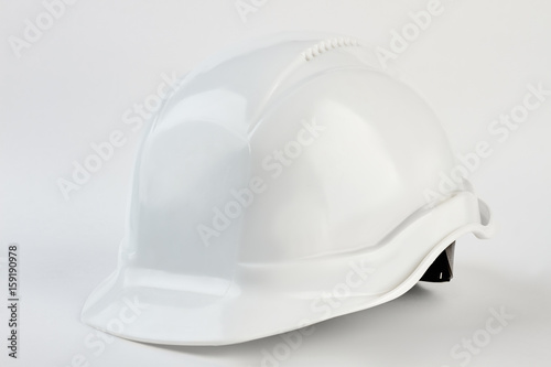 White safety helmet for foreman. Plastic head equipment on manufacture.