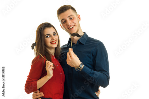 cheerful young couple having fun with a sham