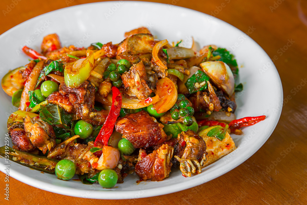 Stir-fried frog and basil on wooden Amazing Thailand spicy food Stir-fried frog and basil on wooden Amazing Thailand spicy food