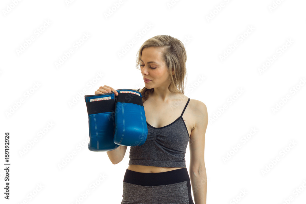 blonde slim sports woman in unifrom with boxing gloves in her hands blonde slim sports woman in unifrom with boxing gloves in her hands