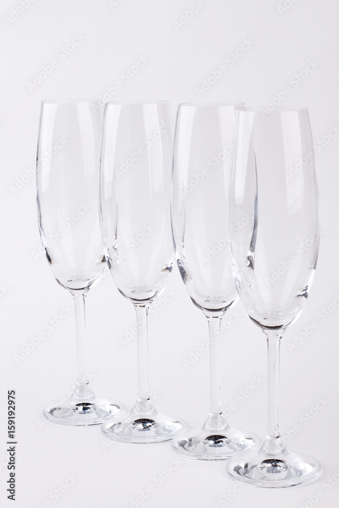 Set of champagne glasses. Four empty glasses, white background. Set of champagne glasses. Four empty glasses, white background.