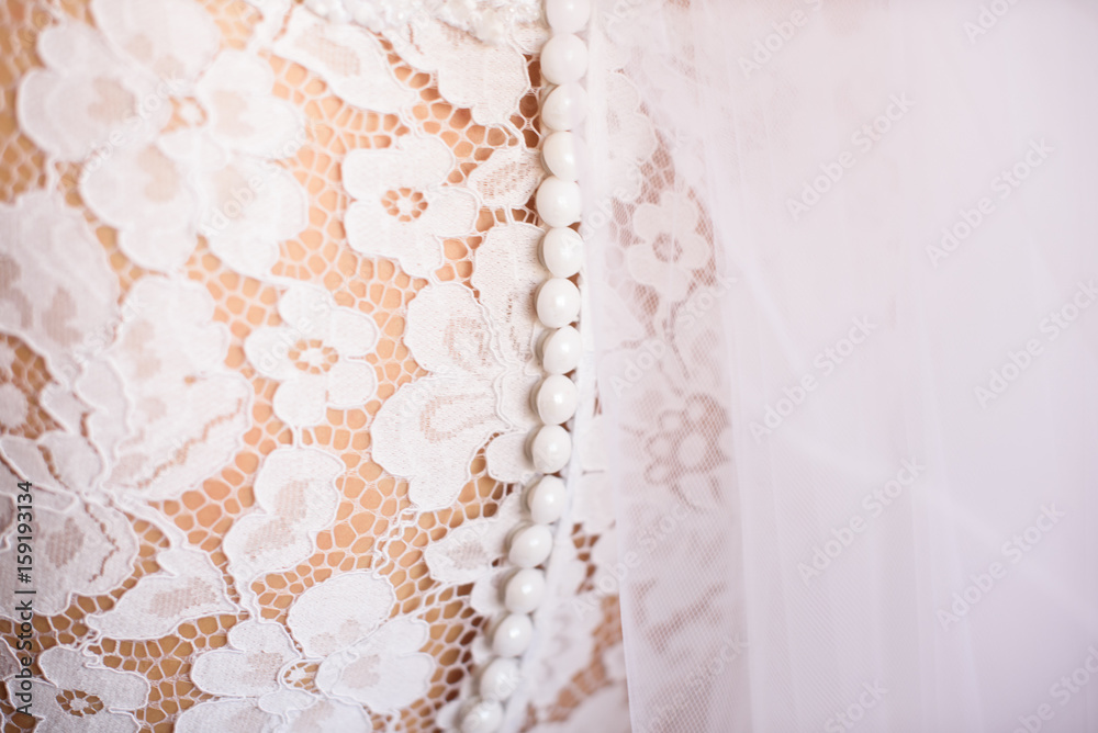part of the wedding dress on the bride