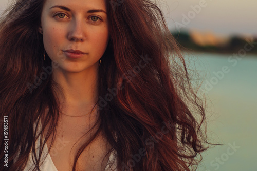 Wallpaper Mural Portrait of a woman with long hair at sunset close-up Torontodigital.ca