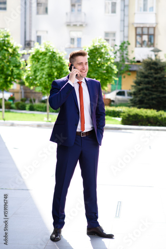 Successful businessman talking on the phone. © fotofrol